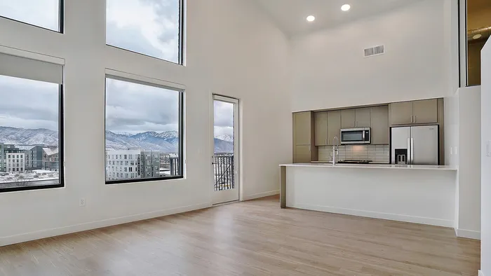 Open living space with tall ceilings in a Greenside penthouse apartment