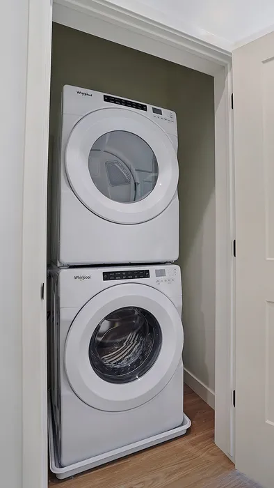 Stacked washer and dryer inside a Greenside penthouse apartment