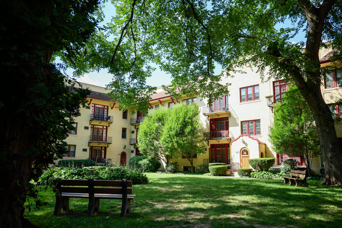 Elegant exterior of Sevilla Court Apartments on the Main Line with European-inspired design.