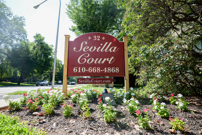 Elegant exterior of Sevilla Court Apartments on the Main Line with European-inspired design.
