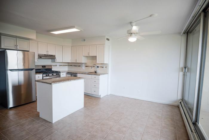 Kitchen with stainless steel appliances and fresh finishes at Wynnewood House.