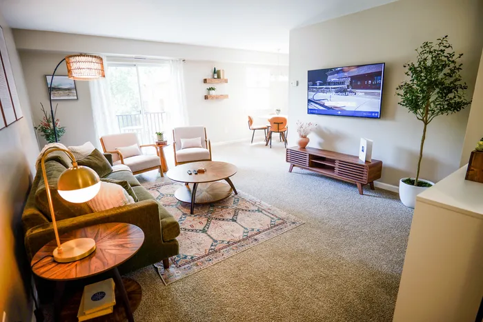 Inviting living room with elegant furnishings, cozy seating area, and natural light creating a warm ambiance.