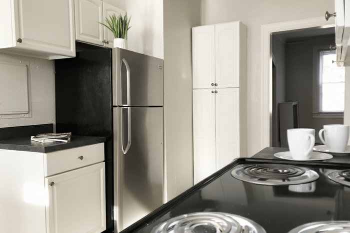 Sleek kitchen with stainless steel appliances, elegant cabinetry, and stylish decor, offering a modern and inviting cooking space.