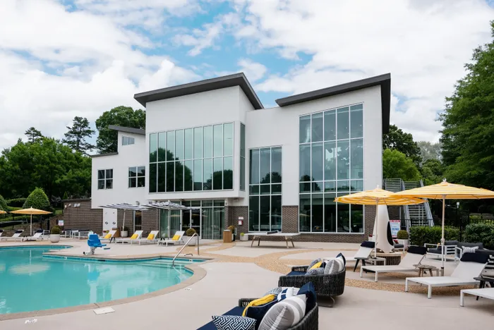 pool with clubhouse behind