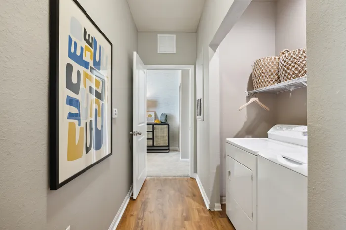 hallway with washer and dryer
