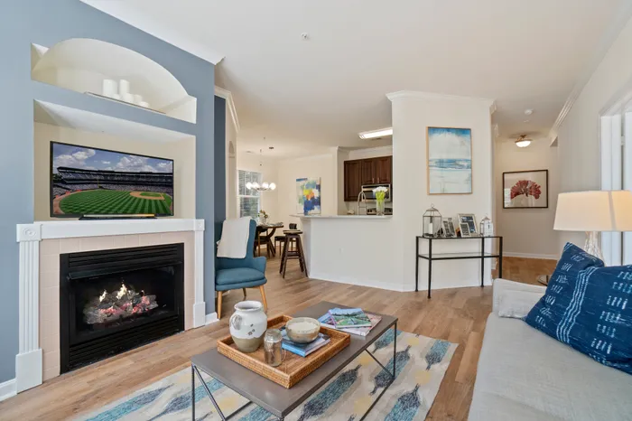 living room with kitchen in background