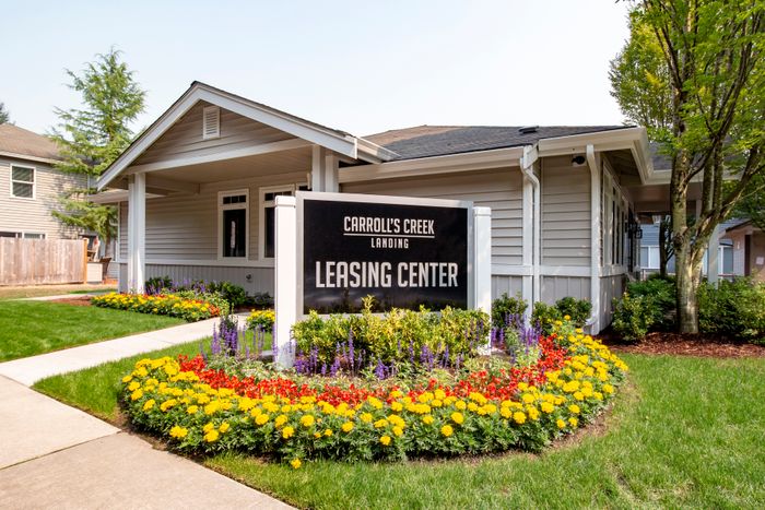 leasing sign in front of office