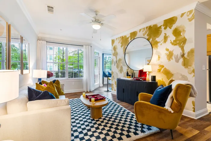 living room white couch with colorful wallpaper