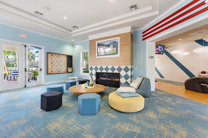 fireplace and seating area with blue carpet