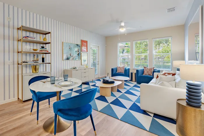 bright room with dining furniture and living room