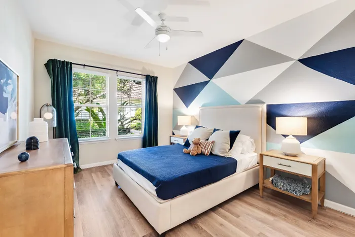 bedroom with blue blanket on bed