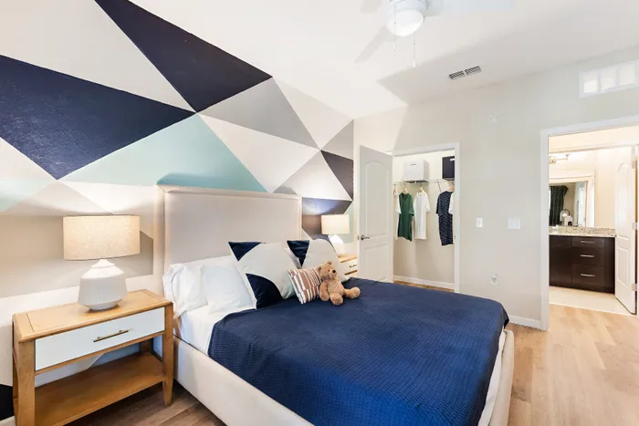 bedroom with blue blanket on bed