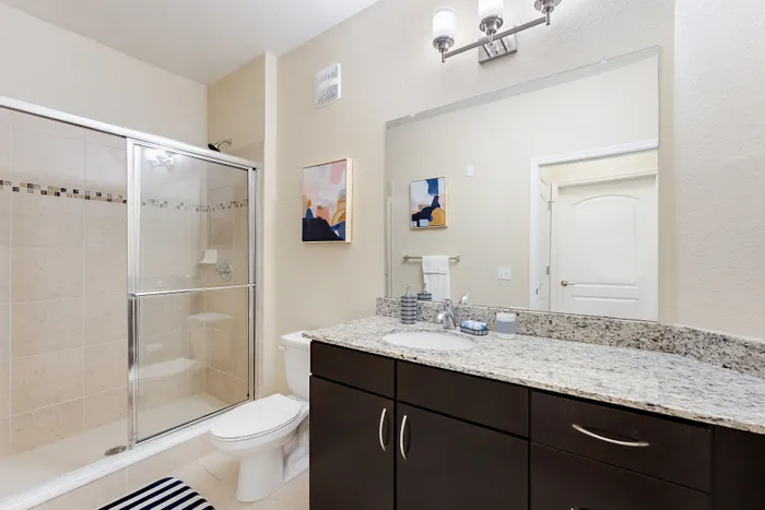 bathroom with brown cabinets