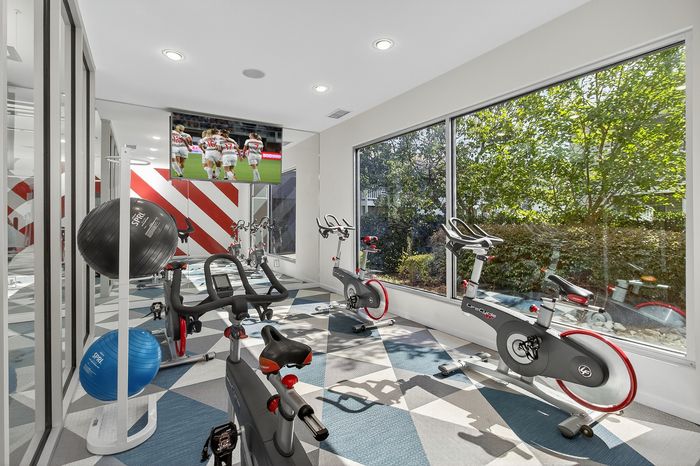 fitness center with colorful carpet