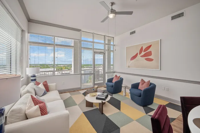 spacious living room with wall art