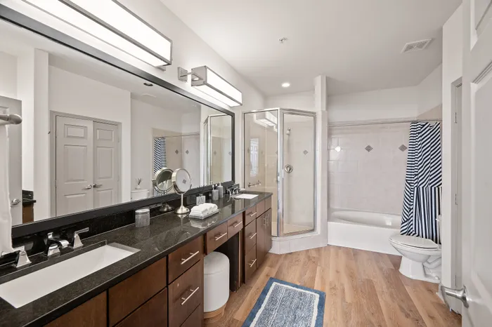 bathroom with standup shower and tub