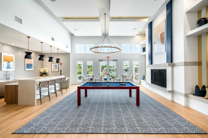 clubhouse with billiards and chandelier