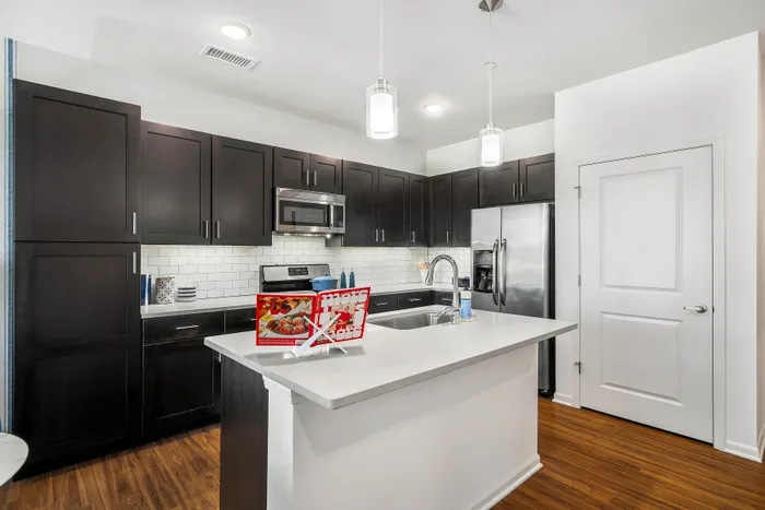 kitchen with brown cabinetry and island