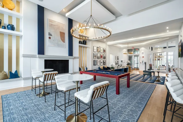 clubhouse and white lounge chairs