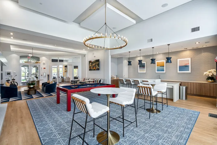 clubhouse and white lounge chairs