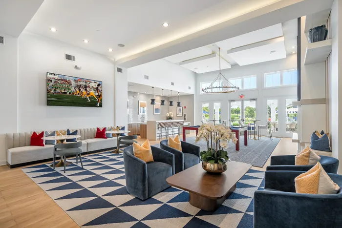 clubhouse with large rug and seating