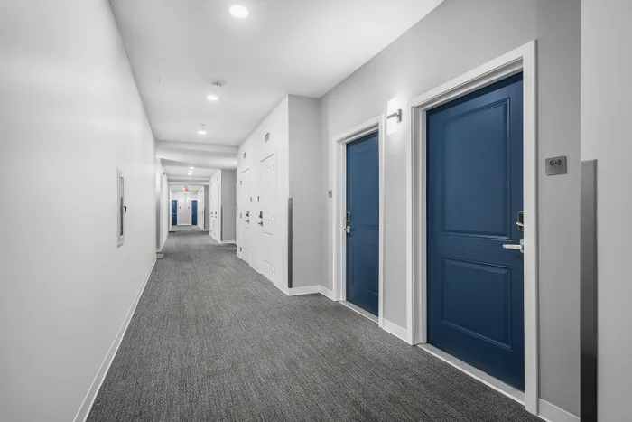 hallway with blue doors