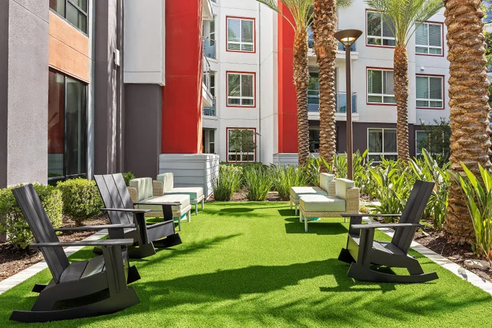 additional seating by pool on green turf