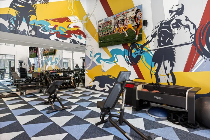 state of the art fitness center with big wall mural
