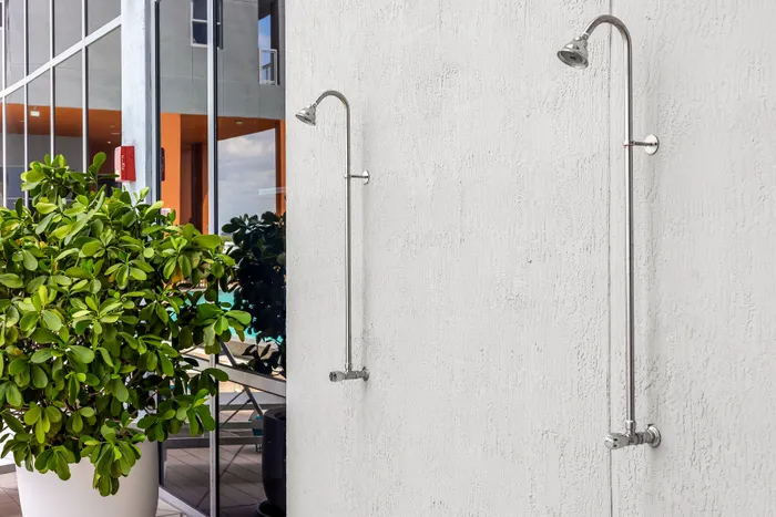 outdoor showers by pool