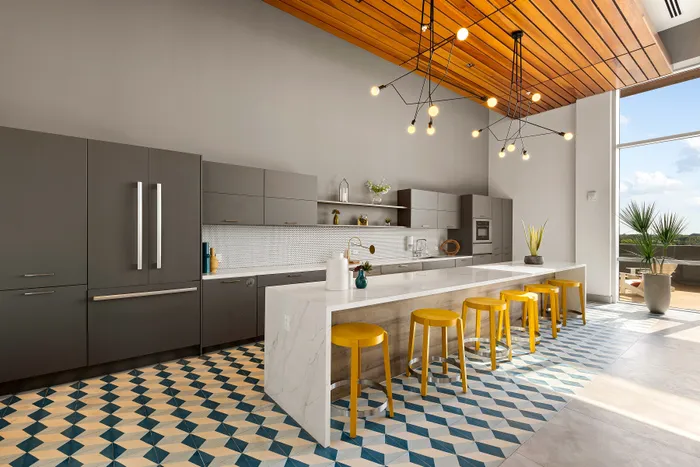 lounge area and kitchen at Motion at Dadeland
