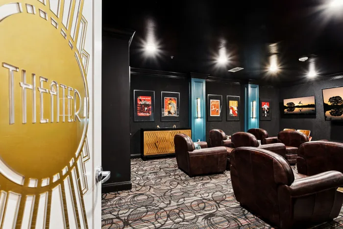 Luxurious home theater with plush leather seating and elegant decor, creating the perfect entertainment experience.