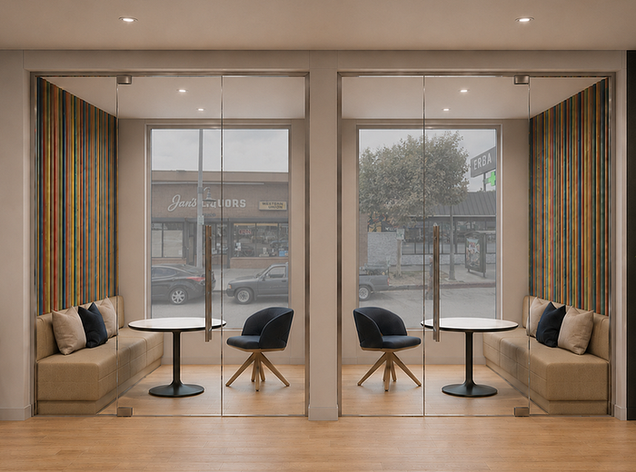 Chic apartment lounge area with modern seating, large glass windows, and vibrant striped wall accents offering a cozy and stylish ambiance.