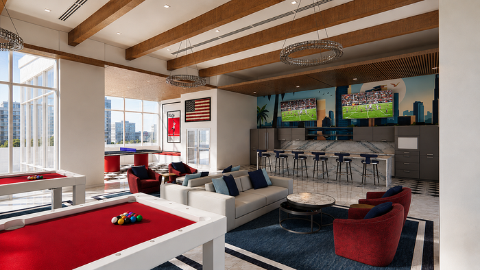 Elegant recreation room with modern pool tables, plush seating, and a sleek bar area featuring multiple flat-screen TVs.