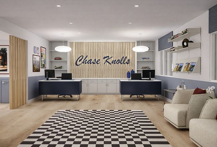 Inviting modern office lobby with stylish checkered flooring, sleek work desks, and chic decor, creating a welcoming atmosphere at Chase Knolls.