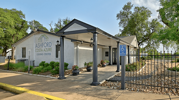 Inviting Ashford Costa Azure leasing center with elegant landscaping and accessible entrance.