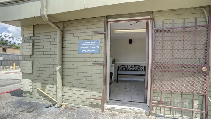 Inviting and convenient onsite laundry facility with a welcoming interior and modern amenities, open daily.