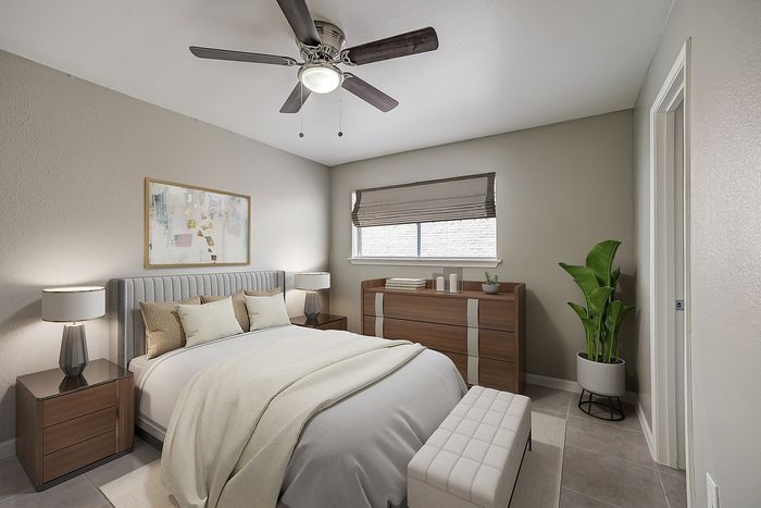 Elegant bedroom showcasing a plush bed with neutral linens, modern wooden furniture, and soft lighting for a cozy ambiance.