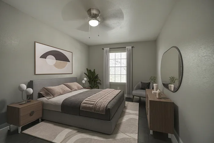 Elegant bedroom showcasing modern decor with a plush gray bed, stylish artwork, and abundant natural light.