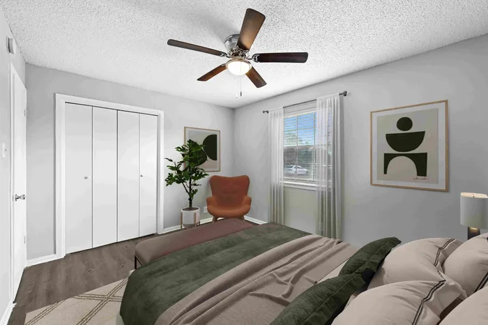 Inviting bedroom with modern decor featuring a plush bed, stylish artwork, and ample natural light.