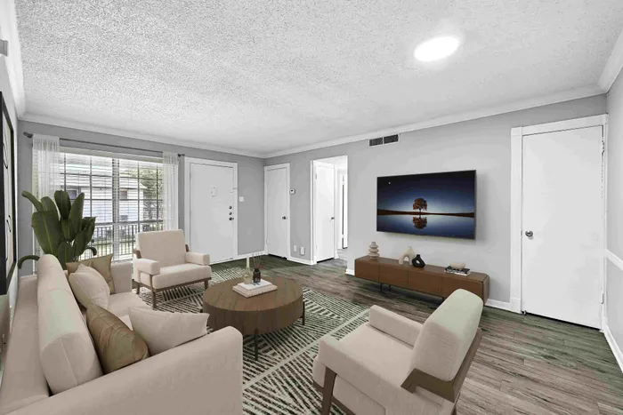 Inviting living room with cozy seating, natural light, and stylish decor, perfect for relaxation and entertaining.