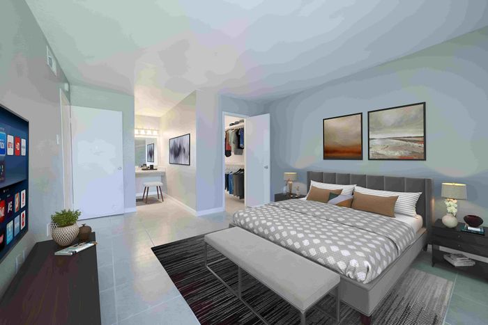 Luxurious modern bedroom with elegant decor, spacious walk-in closet, and cozy ambiance.
