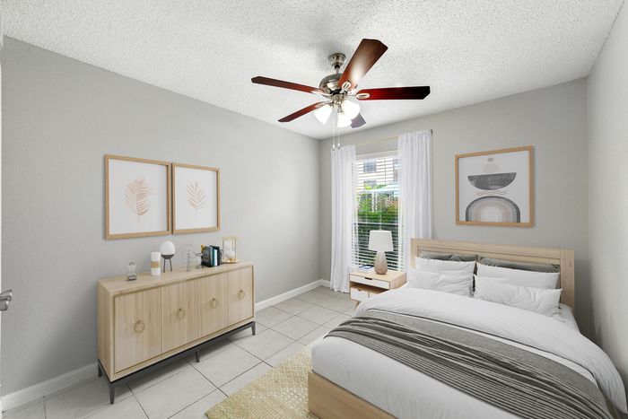 Charming bedroom with modern decor, featuring a cozy bed with white linens, stylish wooden furniture, and elegant wall art.