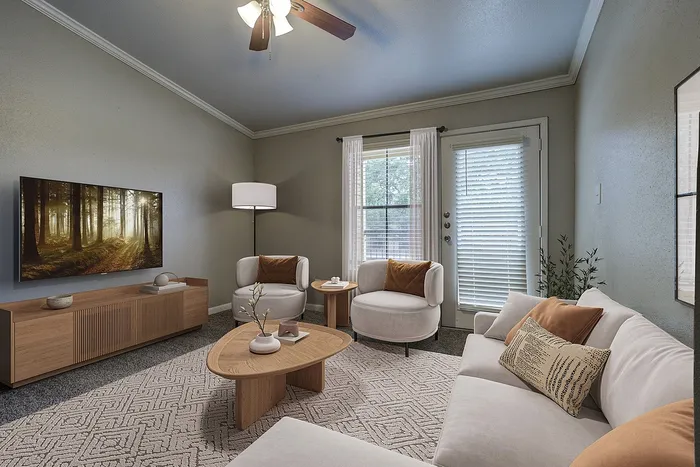 Elegant living room featuring cozy sofa, modern armchairs, stylish wooden tables, and large window with natural light.