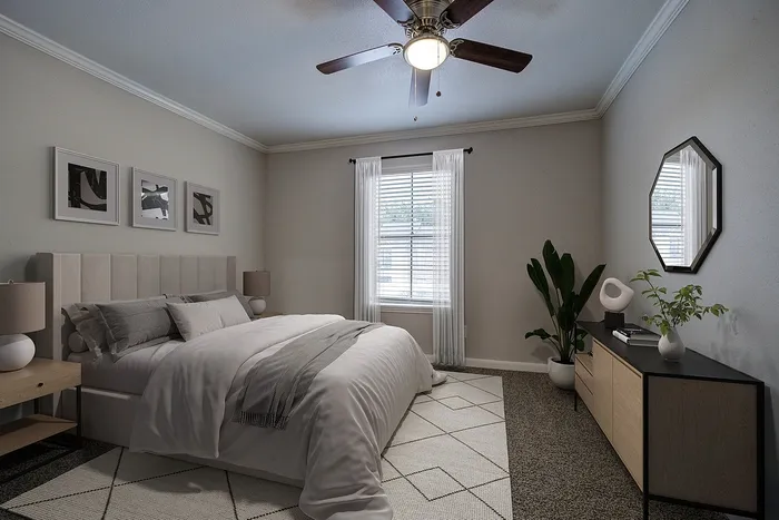 Chic and cozy bedroom with elegant decor, featuring a plush bed, modern furniture, and abundant natural light from a window with stylish drapery.