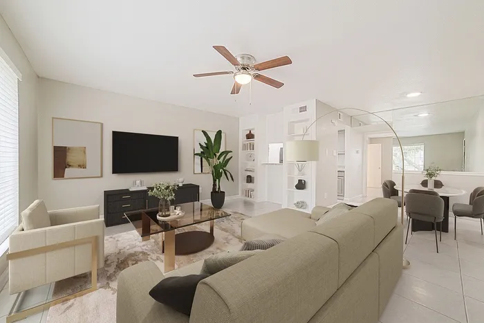 Elegant open-concept living room with modern decor, featuring a cozy sectional sofa, chic coffee table, large TV, and stylish dining area.