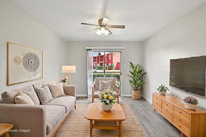Inviting living room with modern decor, plush seating, and natural light showcasing a cozy, vibrant atmosphere.