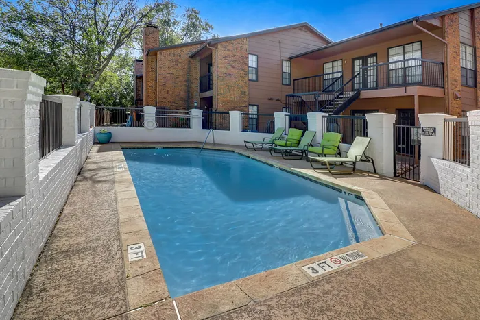 Swimming pool and lounge area at Lakeland Apartments