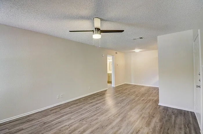 A1 living and dining area with ceiling fan