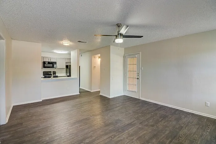 B1 living and dining area with plank-style flooring