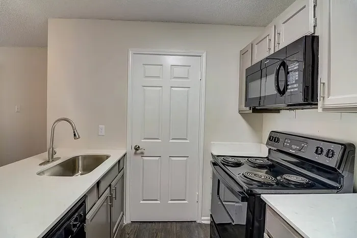 B1 kitchen beside the in-home laundry area